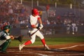 Batter starts his swing at an pitch Royalty Free Stock Photo