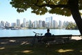 Vancouver, BC, Canada - August 16, 2023: A people on Stanley Park with downtown of the Vancouver at the background Royalty Free Stock Photo