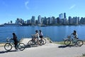 Vancouver, BC, Canada - August 16, 2023: A people on Stanley Park with downtown of the Vancouverat at the background Royalty Free Stock Photo