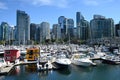 Vancouver, BC, Canada - August 16, 2023: A yachts and boats in the harbor of Vancouver with downtown in the background Royalty Free Stock Photo