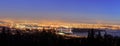 Vancouver BC Canada Cityscape with Stanley Park and Lions Gate Bridge Over Burrard Inlet at Evening Blue Hour Royalty Free Stock Photo