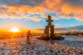 Vancouver BC Canada. February 2021. Inukshuk Vancouver in the winter with sunset light backgrounds Royalty Free Stock Photo