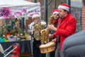 Vancouver, BC, Canada - 11/25/18: Jazz musicians playing saxophone, drum, and trumpet at Yaletown CandyTown even in Vancouver, B.C