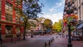 The famous Water Street with its Steam Clock, Shops and Restaurants in the historic Gastown part of Vancouver Royalty Free Stock Photo