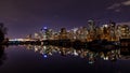 A night long exposure photo of Vancouver skyline with boats docked inside marina Royalty Free Stock Photo