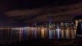 Ancouver skyline at night. Long exposure photo of city downtown behind a harbor
