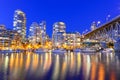 Vancouver BC skyscrapers and Granville Bridge reflection along False Creek at blue hour Royalty Free Stock Photo