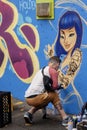 Vancouver,British Columbia,Canada, August 10th,2019: An artist painting a mural at the Vancouver Mural Festival 2019