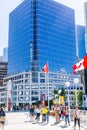 Canadian flags everywhere and people enjoying the surroundings at Canada Place, Vancouver Harbour on Canada Day