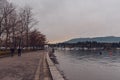 Vancouver, British Columbia/Canada - December 24 2017: Coal harbour bay - waterfront in downtown park with some people walking. Royalty Free Stock Photo