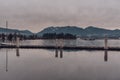 Vancouver, British Columbia/Canada - December 24 2017: Coal harbour bay - waterfront in downtown with mountains in background. Royalty Free Stock Photo