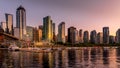 Sunset over the High Rise Buildings, Float Plane Terminal and Cruise Ship Terminal along the shore of Coal Harbor, Vancouver Royalty Free Stock Photo