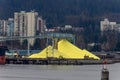 A large pile of sulphur powder stockpiled at a depot ready for use Royalty Free Stock Photo