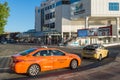 Orange taxi in Vancouver near Canada Place