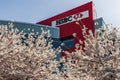 VANCOUVER, CANADA - APRIL 06, 2020: Cherry trees with fresh pink flowers in spring with HSBC building in background
