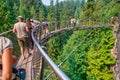 Vancouver, Canada - August 11, 2017: People at Capilano Bridge. It is a Suspension bridge crossing the Capilano River, 140 metres Royalty Free Stock Photo