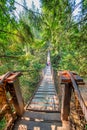 Vancouver, Canada - August 11, 2017: People at Capilano Bridge. It is a Suspension bridge crossing the Capilano River, 140 metres Royalty Free Stock Photo