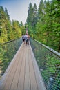 Vancouver, Canada - August 11, 2017: People at Capilano Bridge. It is a Suspension bridge crossing the Capilano River, 140 metres Royalty Free Stock Photo