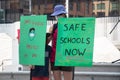 View of sign Safe Schools Now taken during Vancouver rally for mandatory masks in schools outside the Vancouver Art Gallery