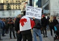 Protestants with posters marching in downtown of Vancouver, Canada