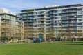 Vancouver, Canada - February 9, 2018: Outside green grass at Willow park near residential high storey buildings.
