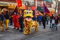 VANCOUVER, CANADA - February 18, 2014: People in Yellow Lion Costume at Chinese New Year parade in Vancouver Chinatown.