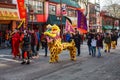 VANCOUVER, CANADA - February 18, 2014: People in Yellow Lion Costume at Chinese New Year parade in Vancouver Chinatown.