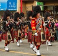 VANCOUVER, CANADA - February 2, 2014: scottish kilt Pipe band march in Chinese New Year parade in Vancouver Canada.