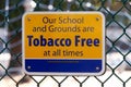 View of yellow sign `Our school and grounds are Tobacco Free at all times` in Vancouver