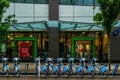 VANCOUVER, CANADA - JUNE 10, 2020: city street with mobi bike share station in front of old navy store.