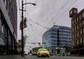 VANCOUVER, CANADA - JUNE 6, 2018: Granville street with yellow taxi and tall buildings in the morning.