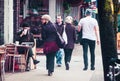 Woman looking at Vancouver store front