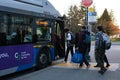 Vancouver, Canada 2023 People lining up to board a Translink bus on West Georgia Street in Downtown Vancouver