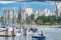 Ferry and docked boats under the Burrard Bridge