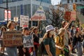 Young activists with signs walking down Cambie Street as part of the Global Climate Strike in Vancouver