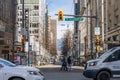 Vancouver City Centre street view. People and cars crossing Granville St and W Georgia St.