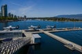 Vancouver city seaplanes airport. Harbor aviation in downtown - planes stand on water nearby pier