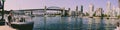 Vancouver False Creek panorama at sunset with bridge and boat.