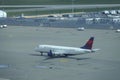 AERIAL: Delta airplane taxis towards the Vancouver airport to start boarding. Royalty Free Stock Photo