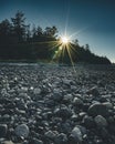 Vancouver Island beach view on a clear blue sky with sunstar and pacific coast. Canada. Royalty Free Stock Photo