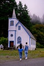 Vancouver Island, Canada, Quadra Island old historical church by the harbor at Cape Mudge , couple on vacation at