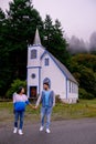 Vancouver Island, Canada, Quadra Island old historical church by the harbor at Cape Mudge , couple on vacation at