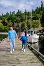 Vancouver Island, Canada, Quadra Island old historical harbor with fishing boat at Cape Mudge , couple on vacation at