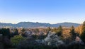 Vancouver panorama in spring at sunset. Blooming trees in the park Royalty Free Stock Photo