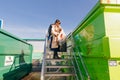 Vancouver Zero Waste Centre - october, 2019 - The girl sorts the garbage at the recycling plant next to the bin