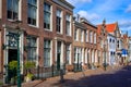 Townhouses along a canal in the medieval historic town of Brielle, South Holland. The Netherlands