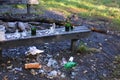 Vandalism in the park. after the night party, only shattered pieces of glass alcohol bottles remained on the bench. The homeless m