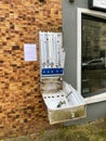 Vandalized durex condom vending machine near pharmacy with fun messaging to the aggressor by the pharmacist