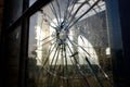 Vandals shatter glass of a window with stones