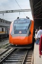 Vande Bharat Express standing at a Junction Railway Station of Indian Railways system in Howrah